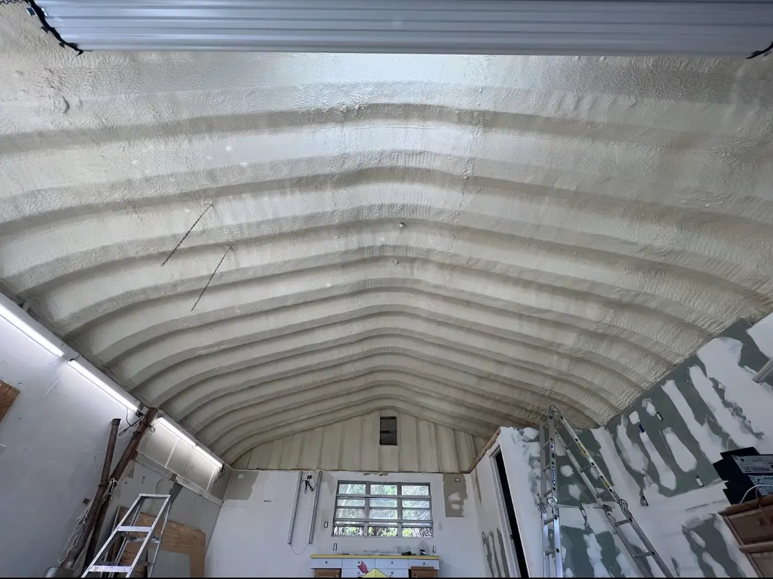 Spray polyurethane foam applied to the underside of a metal roof deck in New Milford